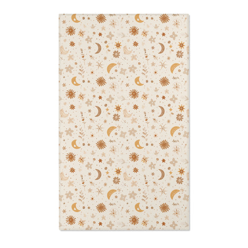 Moon and floral nursery area rug in gold, rust and tan