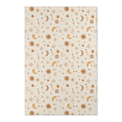 Close detail of the moons and daisies on the nursery area rug