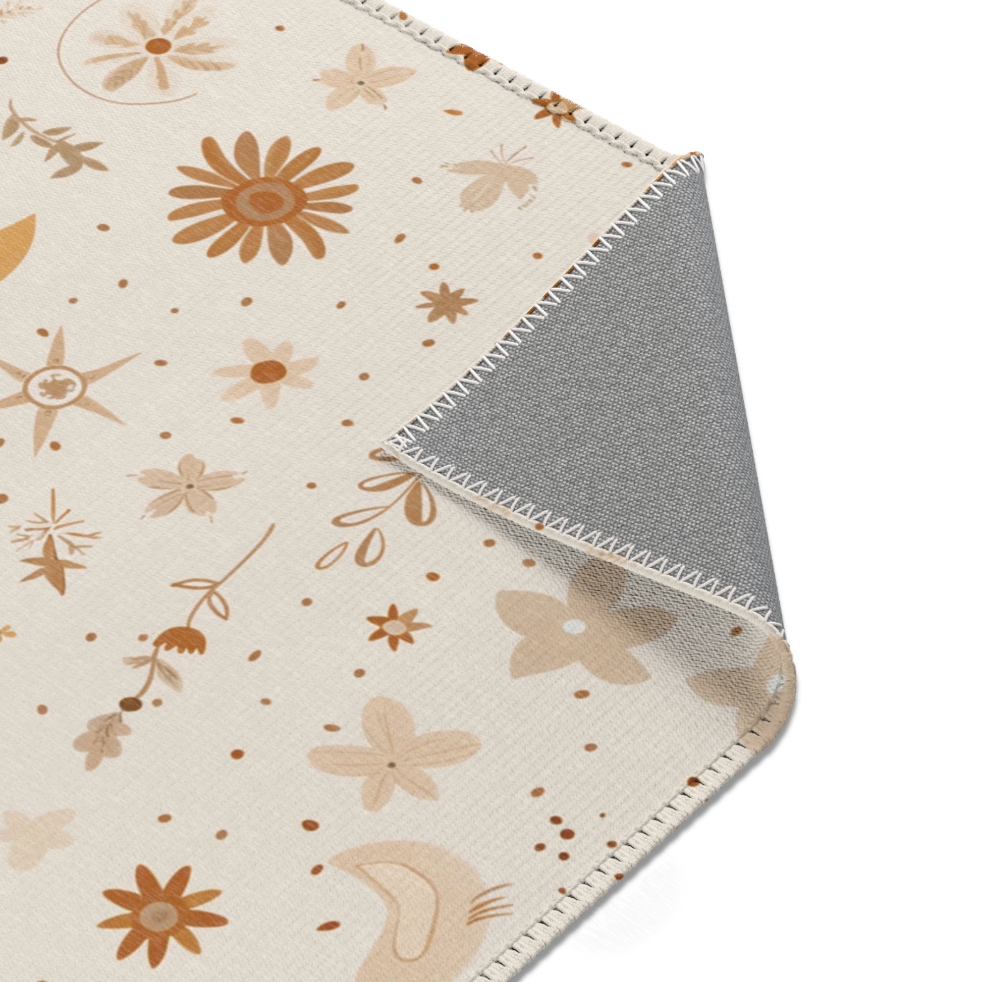 Celestial rug in gold and rust on cream for a nursery floor