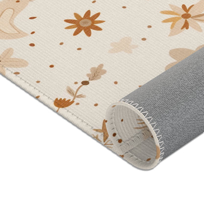 Nursery area rug in a warm gold, rust and cream palette