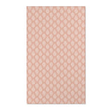 Paisley nursery area rug in cream on dusty clay rose