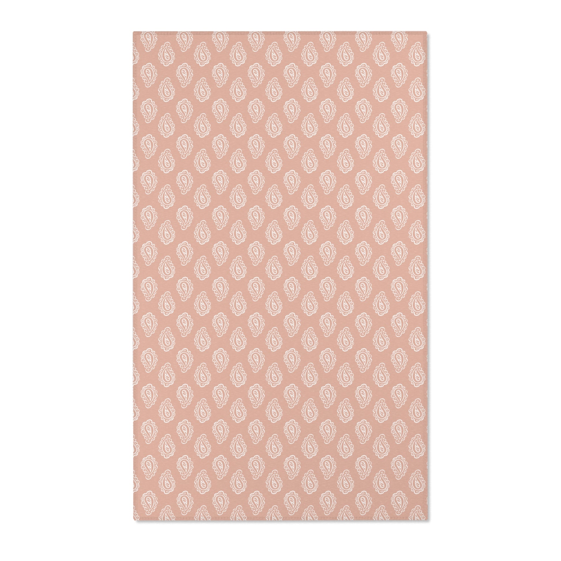 Paisley nursery area rug in cream on dusty clay rose