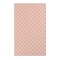 Paisley nursery area rug in cream on dusty clay rose