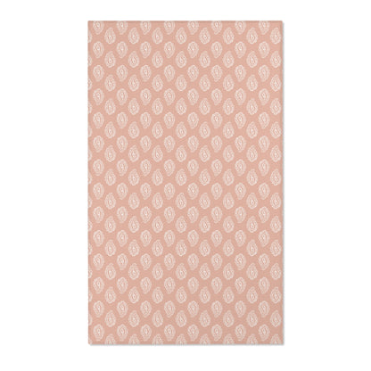 Paisley nursery area rug in cream on dusty clay rose