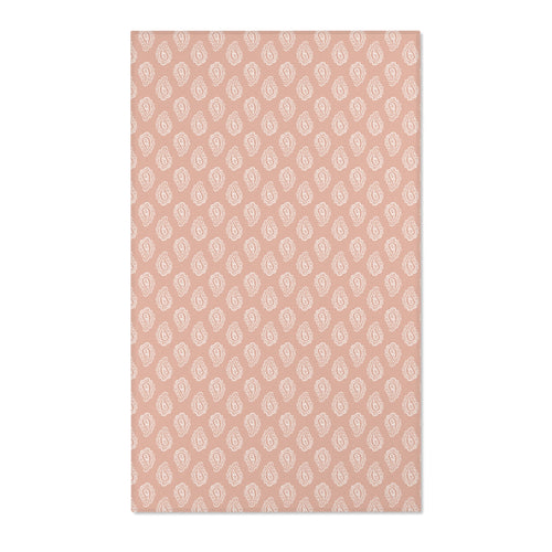 Paisley nursery area rug in cream on dusty clay rose