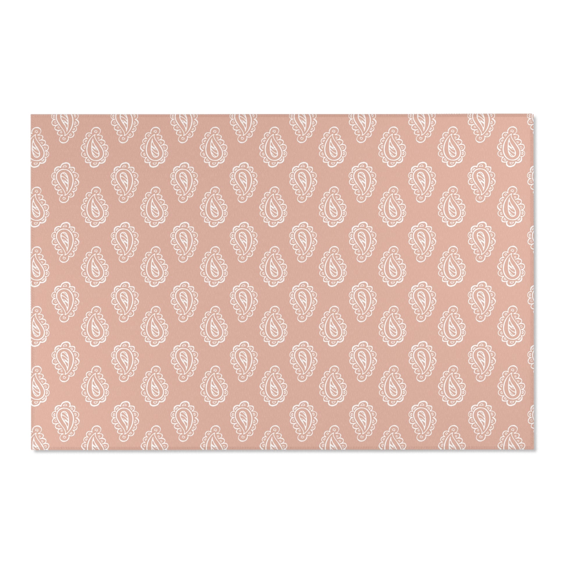 Low pile nursery rug with cream paisley on a rose ground