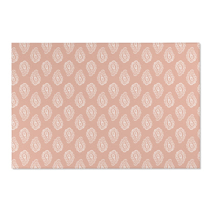 Low pile nursery rug with cream paisley on a rose ground