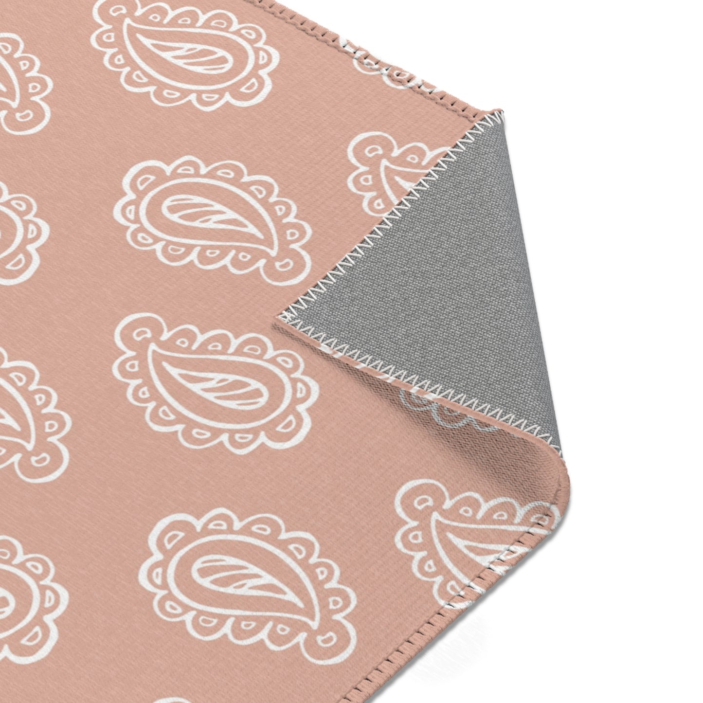 Clay Paisley rug print detail in cream on clay rose