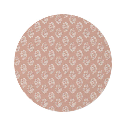 Clay Paisley round nursery rug on a baby room floor