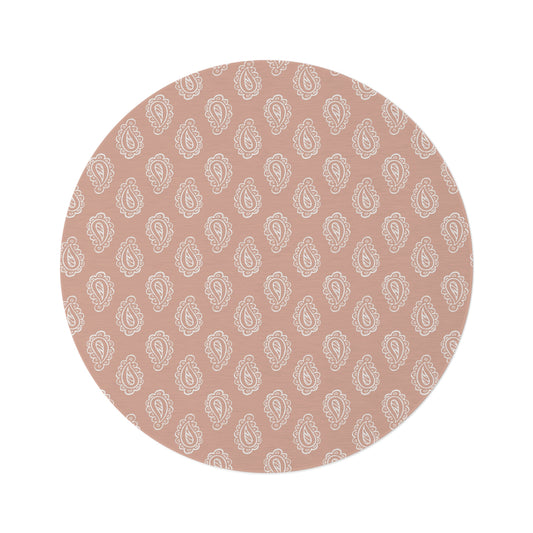 Clay Paisley round nursery rug on a baby room floor