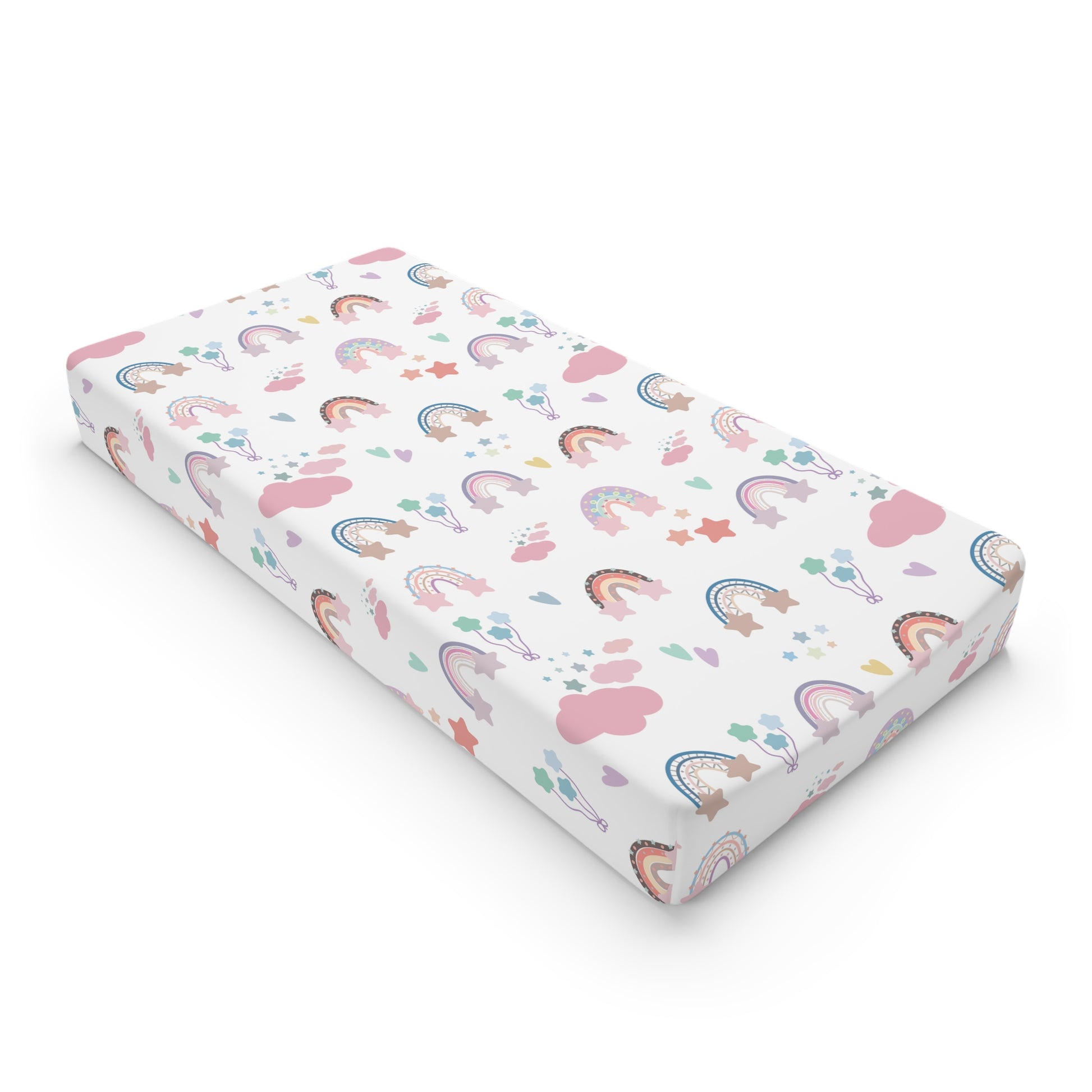 Confetti Rainbows changing pad cover on a nursery changing table