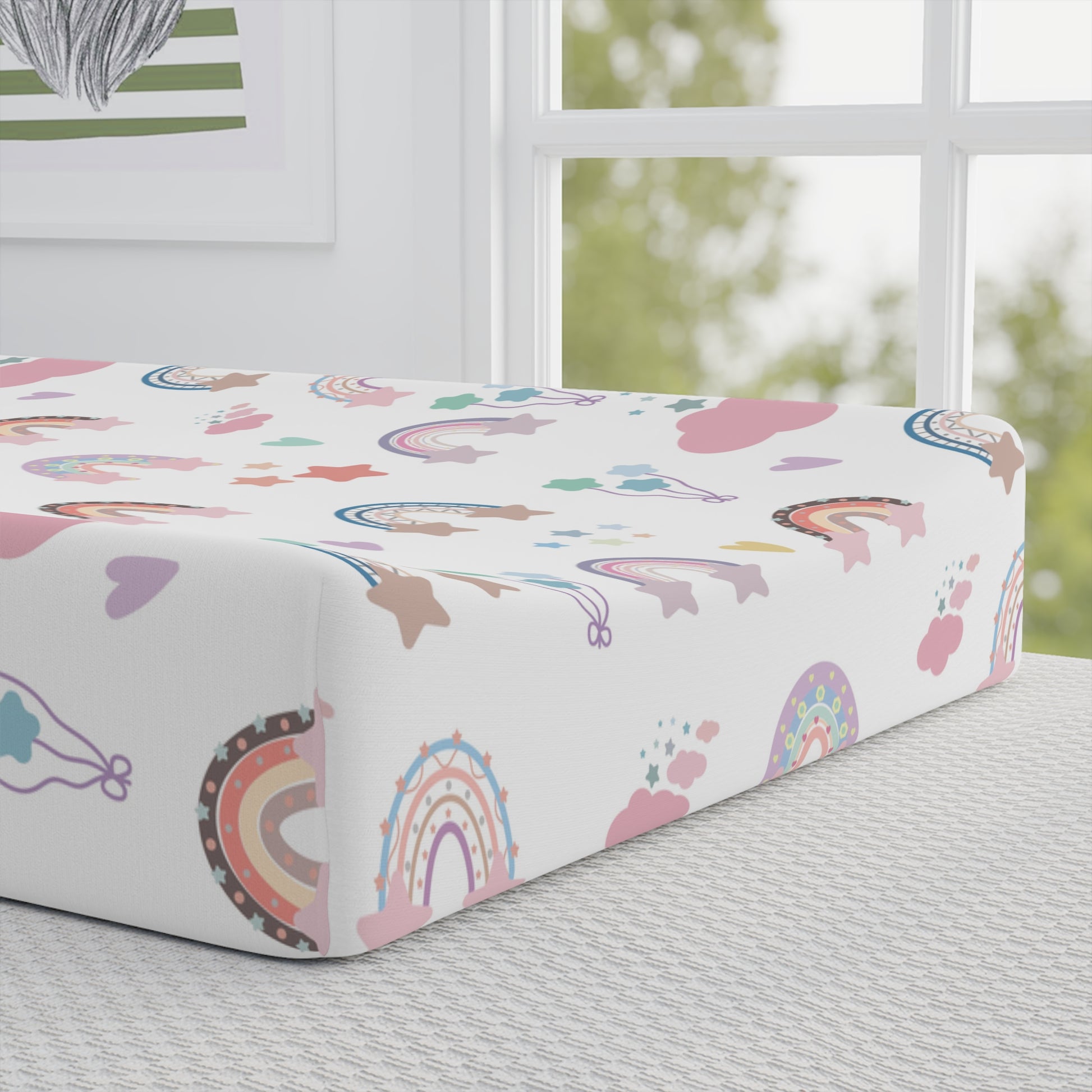 Close detail of the Confetti Rainbows print on the changing pad cover