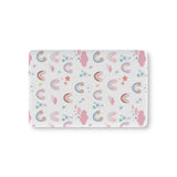 Confetti Rainbows fitted crib sheet on a nursery crib mattress