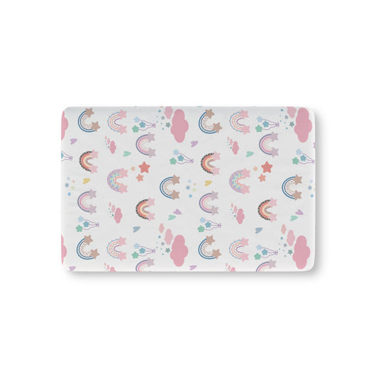 Confetti Rainbows fitted crib sheet on a nursery crib mattress