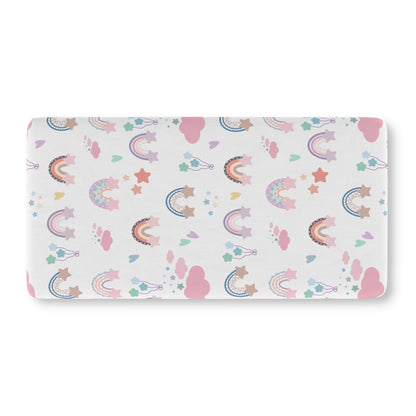 Fitted crib sheet with pastel rainbows and stars on white