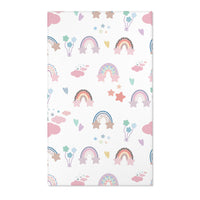 Pastel rainbow nursery area rug on a white ground