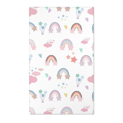 Pastel rainbow nursery area rug on a white ground