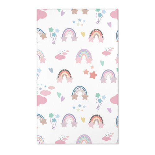 Pastel rainbow nursery area rug on a white ground