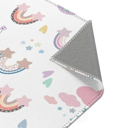 Nursery area rug printed edge to edge with pastel rainbows