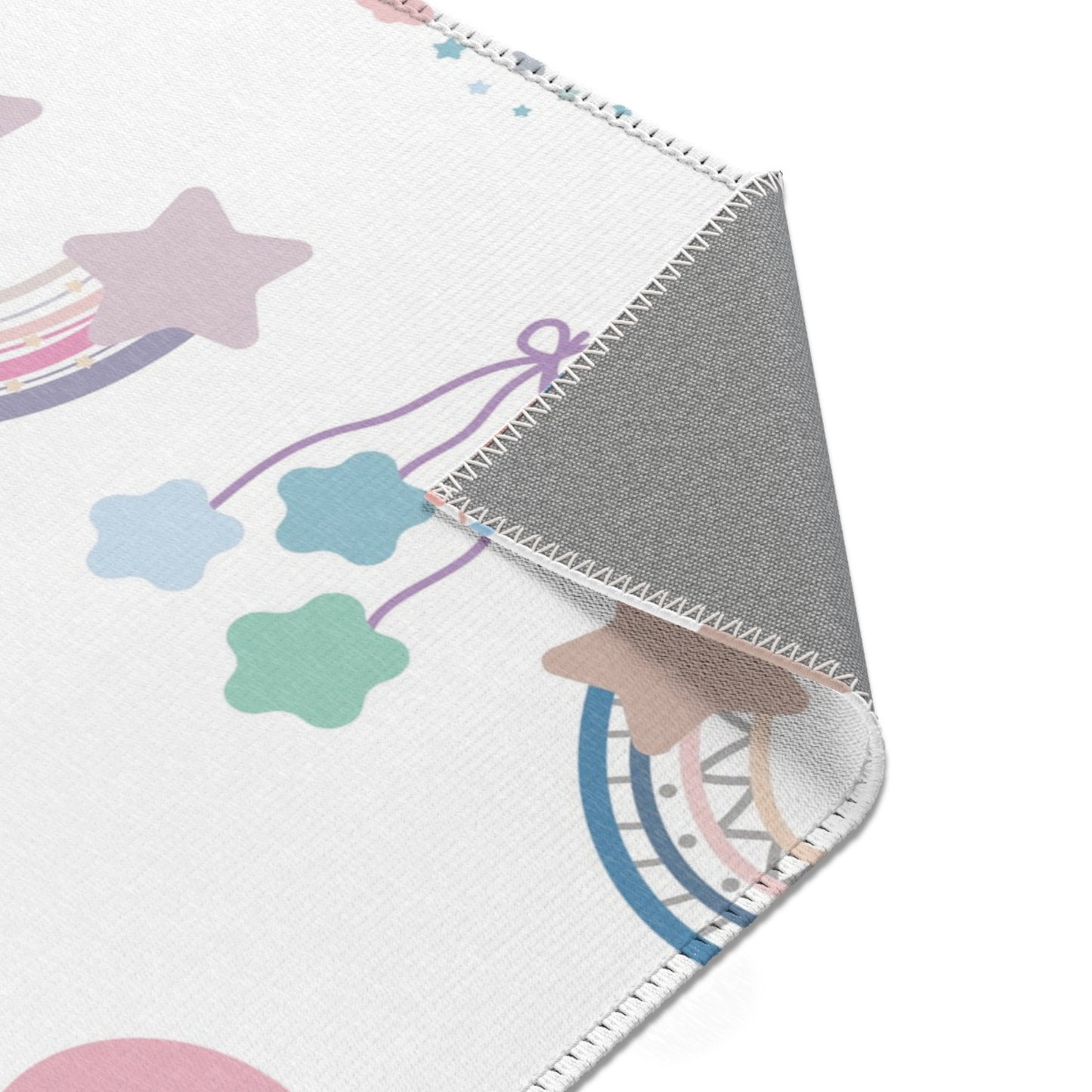 Pastel rainbow rug on white for a nursery floor