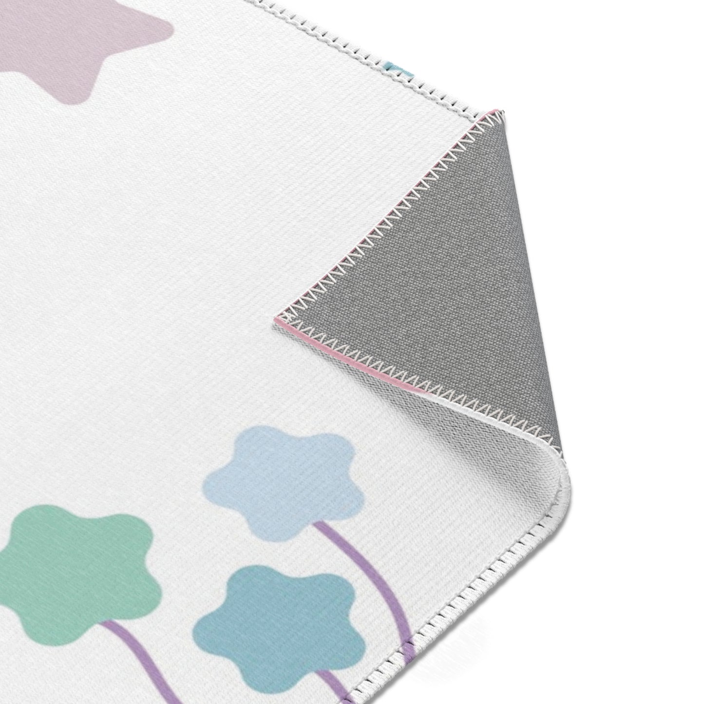 Confetti Rainbows rug print detail in pink and lilac