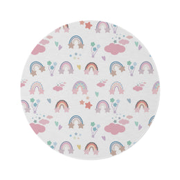 Confetti Rainbows round nursery rug on a baby room floor