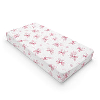 Crimson Bow changing pad cover on a nursery changing table