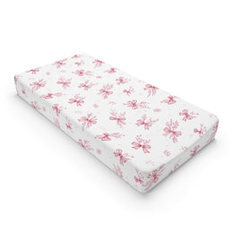 Crimson Bow changing pad cover on a nursery changing table