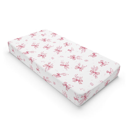 Crimson Bow changing pad cover on a nursery changing table