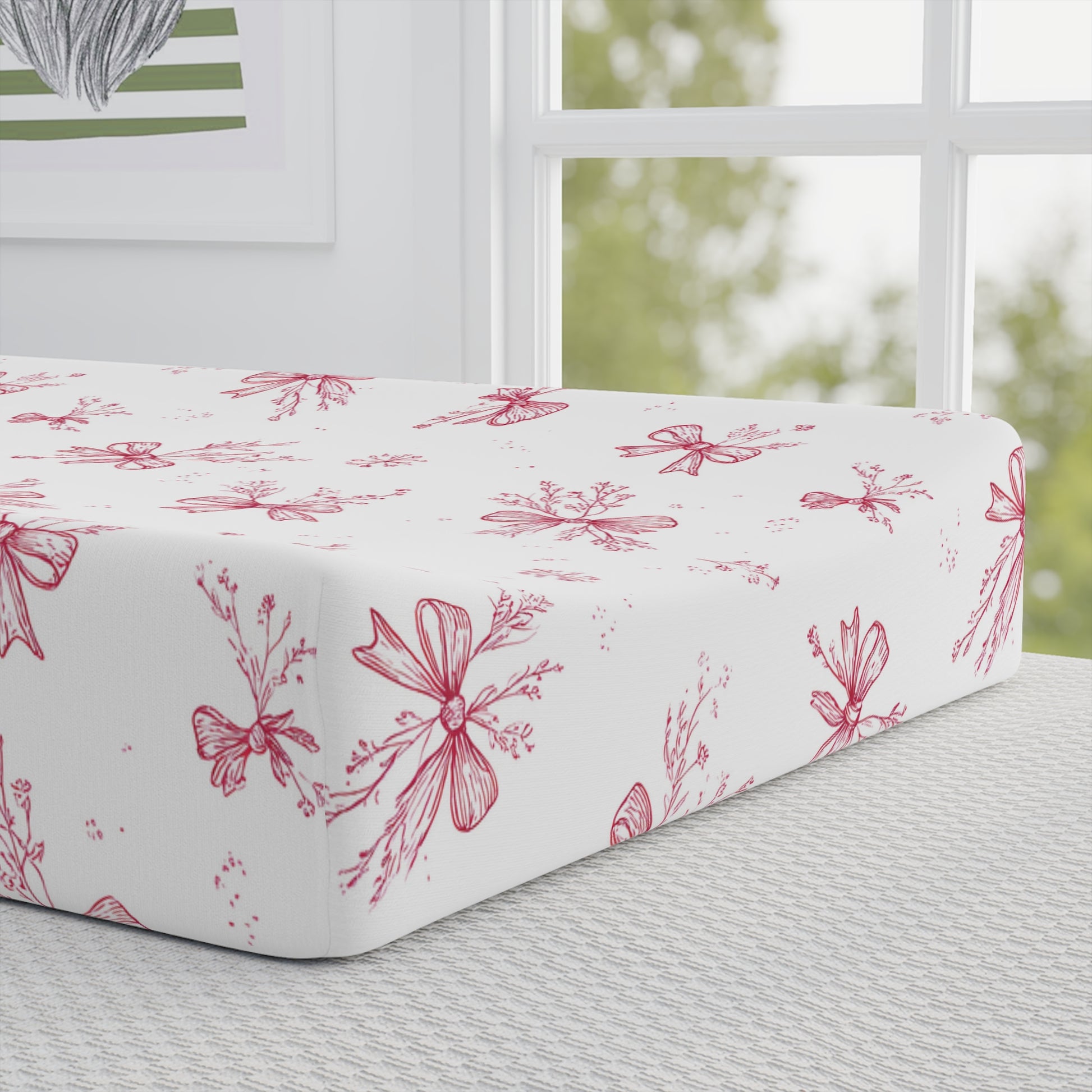 Crimson Bow pad cover matching the nursery crib sheet