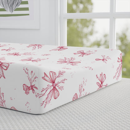 Crimson Bow pad cover matching the nursery crib sheet