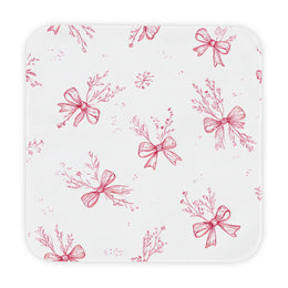 Crimson Bow hooded baby towel wrapped around a baby
