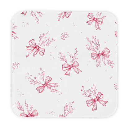Crimson Bow hooded baby towel wrapped around a baby