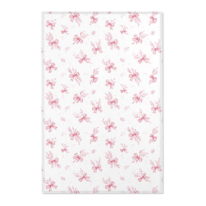 Crimson Bow nursery area rug in a baby girl's bedroom