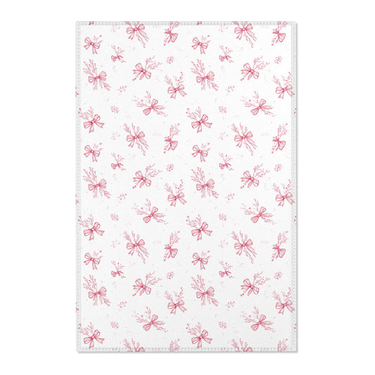 Crimson Bow nursery area rug in a baby girl's bedroom