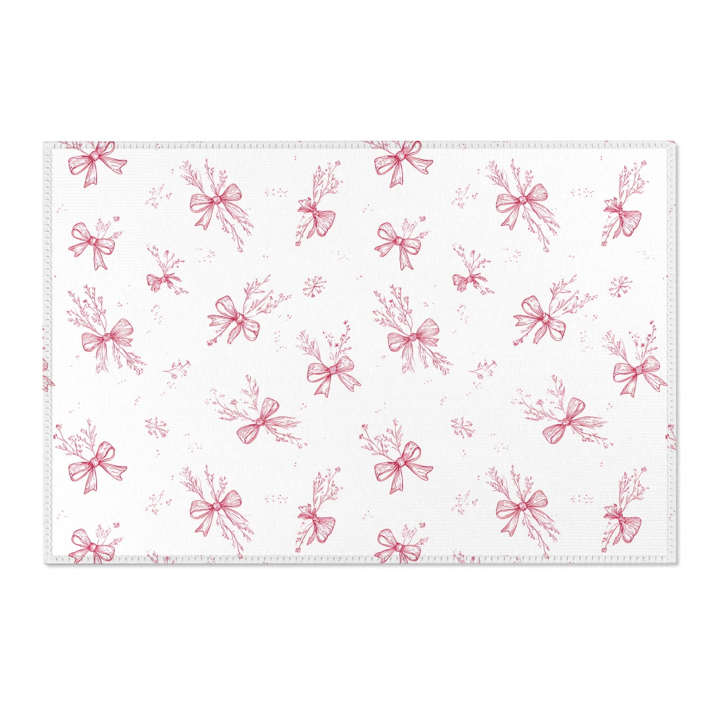 Toile bow print area rug beside a nursery crib