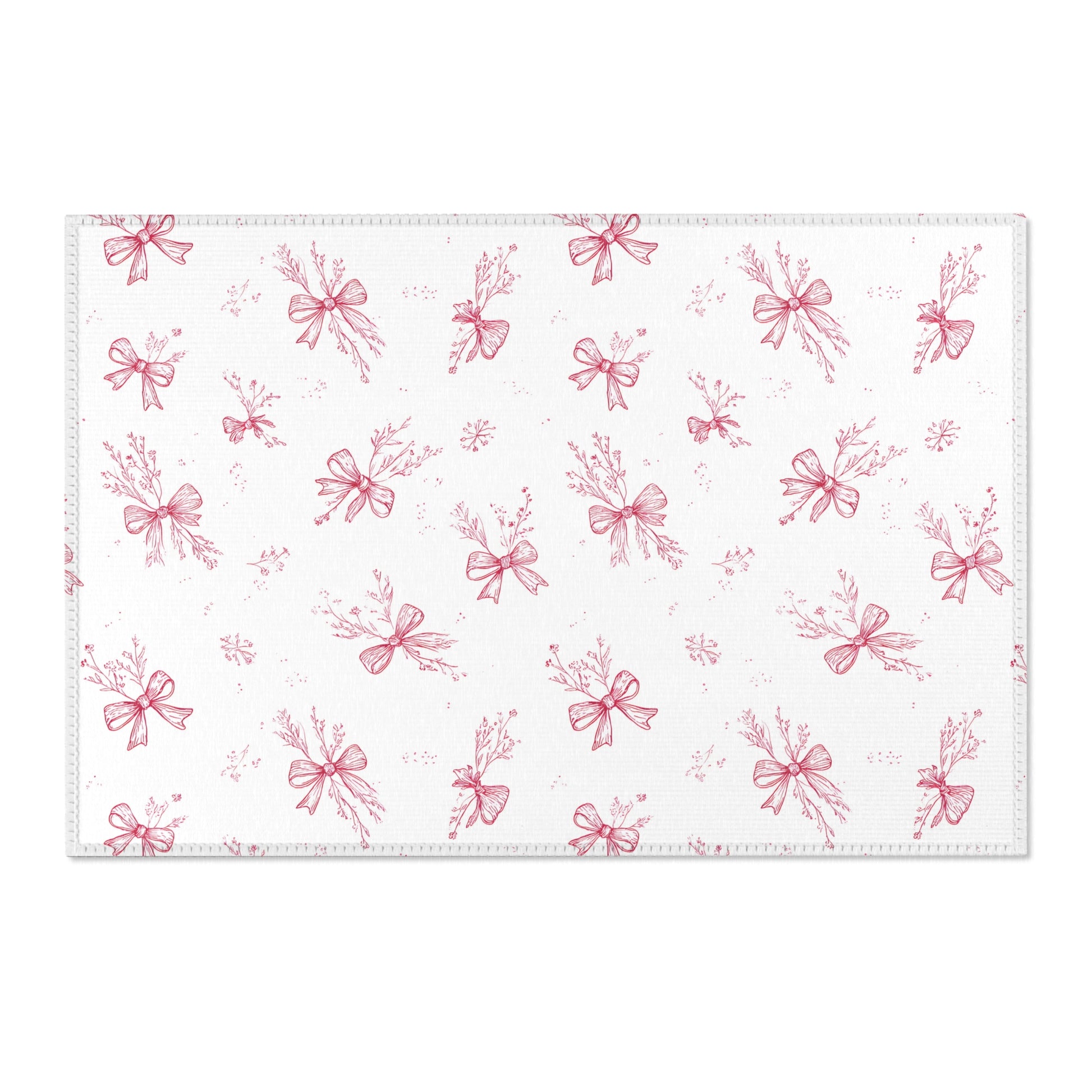 Toile bow print area rug beside a nursery crib