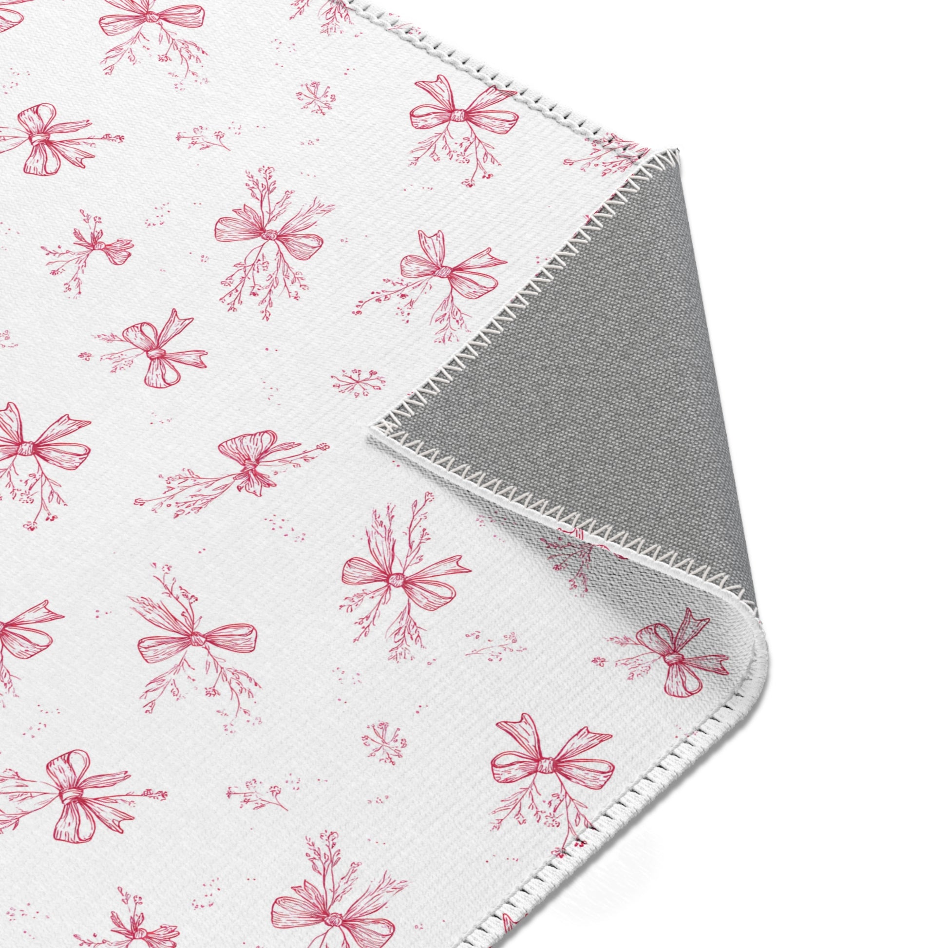 Crimson Bow rug, hand-drawn bows and botanical sprigs
