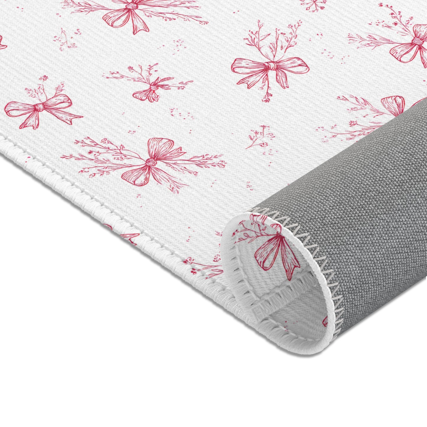 Toile bow nursery rug under a crib