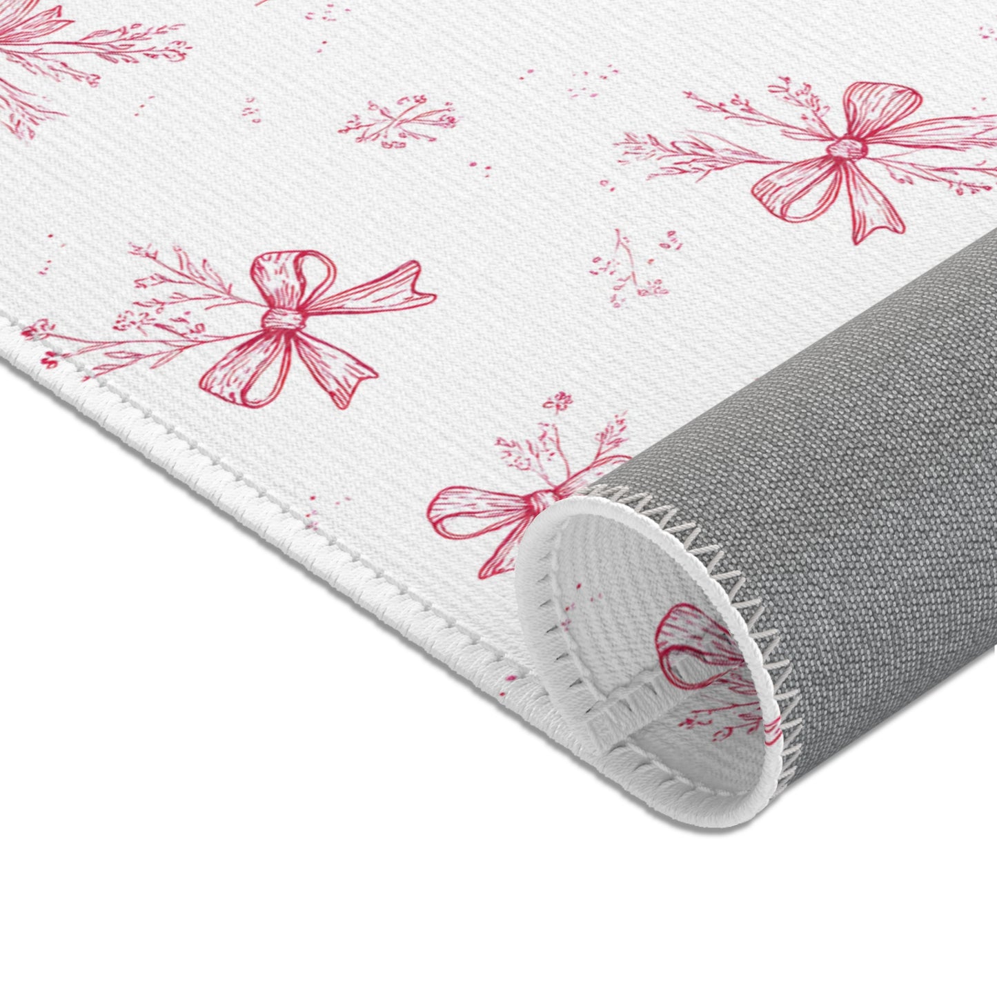 Raspberry toile rug beside a nursery glider chair