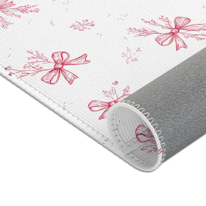 Raspberry toile rug beside a nursery glider chair