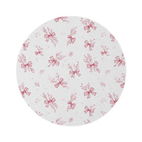 Crimson Bow round nursery rug on a baby room floor