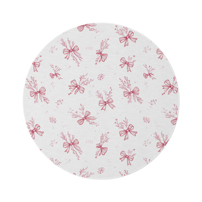 Crimson Bow round nursery rug on a baby room floor