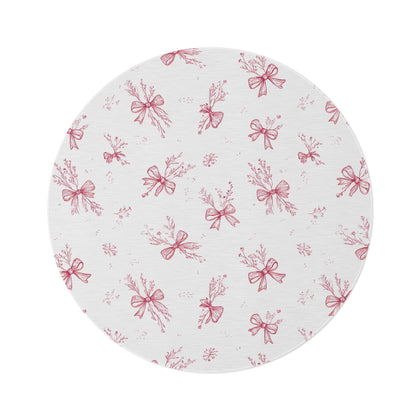 Crimson Bow round nursery rug on a baby room floor