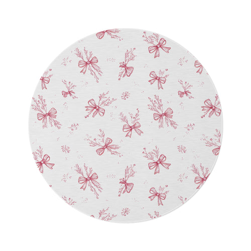 Crimson Bow round nursery rug on a baby room floor