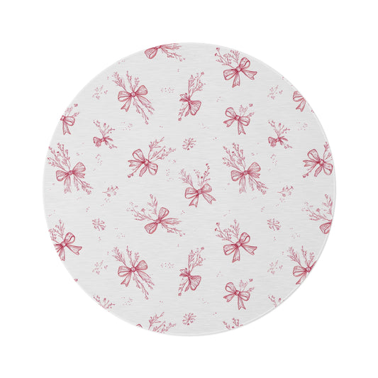 Crimson Bow round nursery rug on a baby room floor