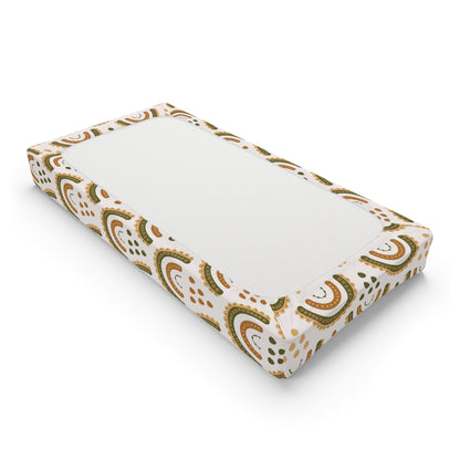 Changing pad cover in earth-toned rainbow arches on cream