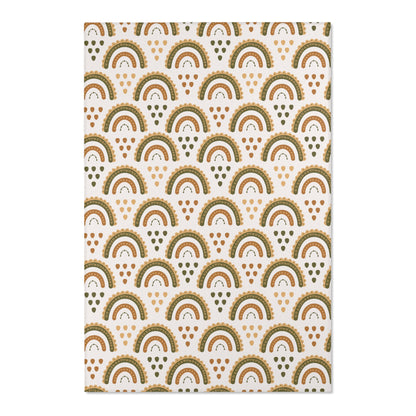 Close detail of the scalloped rainbow arches on the area rug