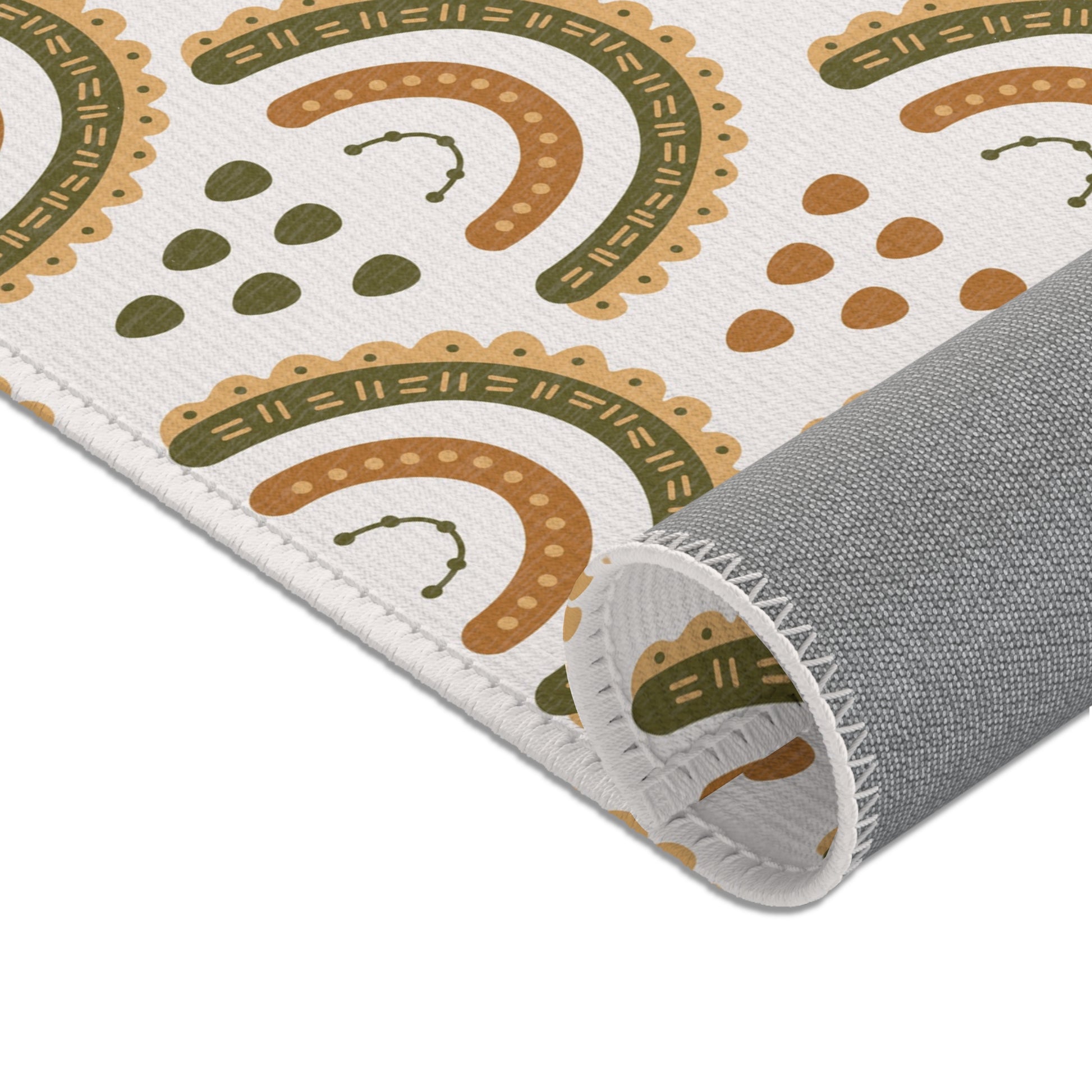 Rows of scalloped rainbows printed across the nursery area rug