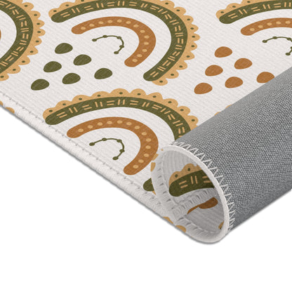 Rows of scalloped rainbows printed across the nursery area rug